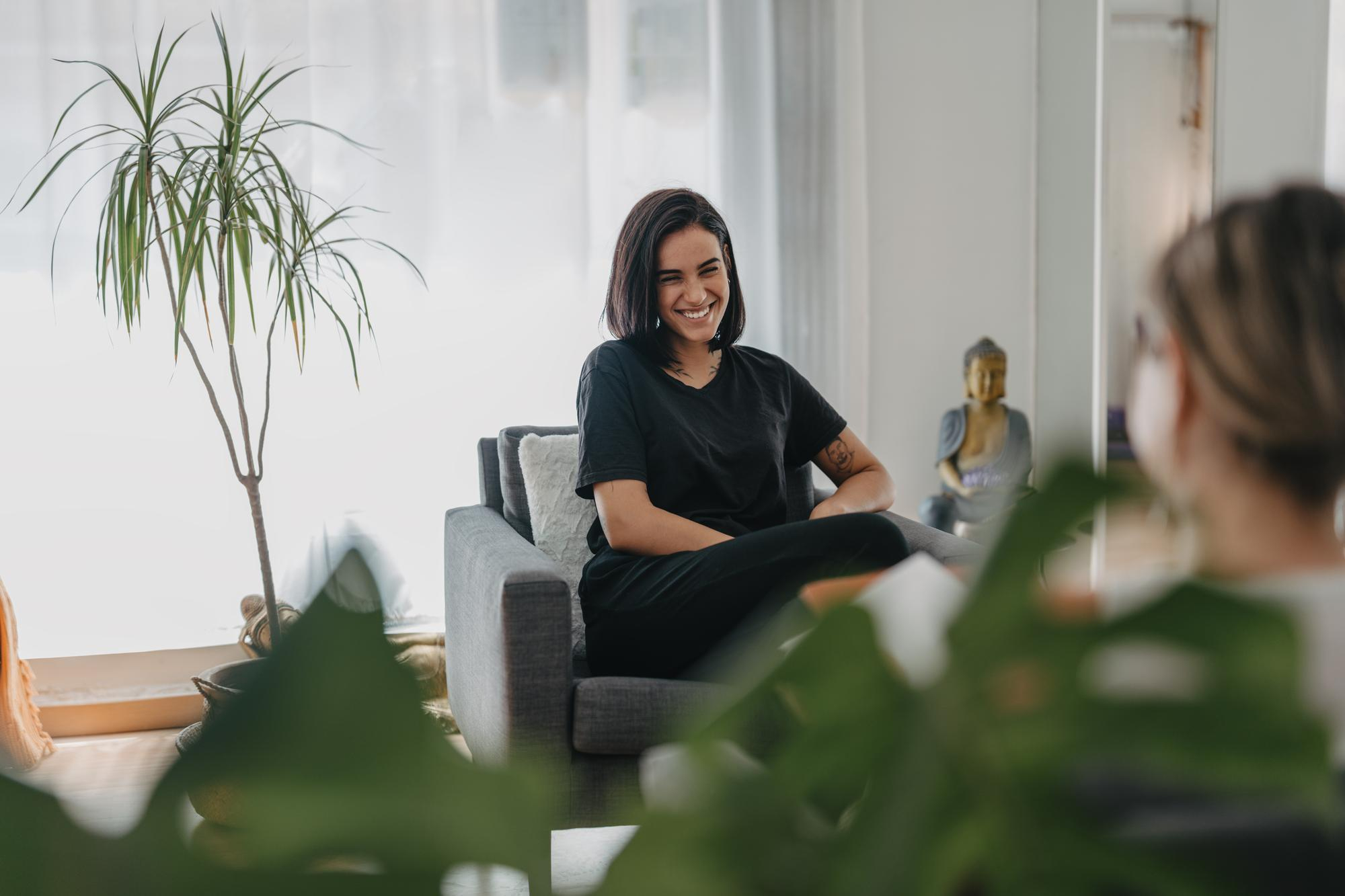 Therapist smiling at her patient during a CBT therapy session in Mount Pleasant, WI.