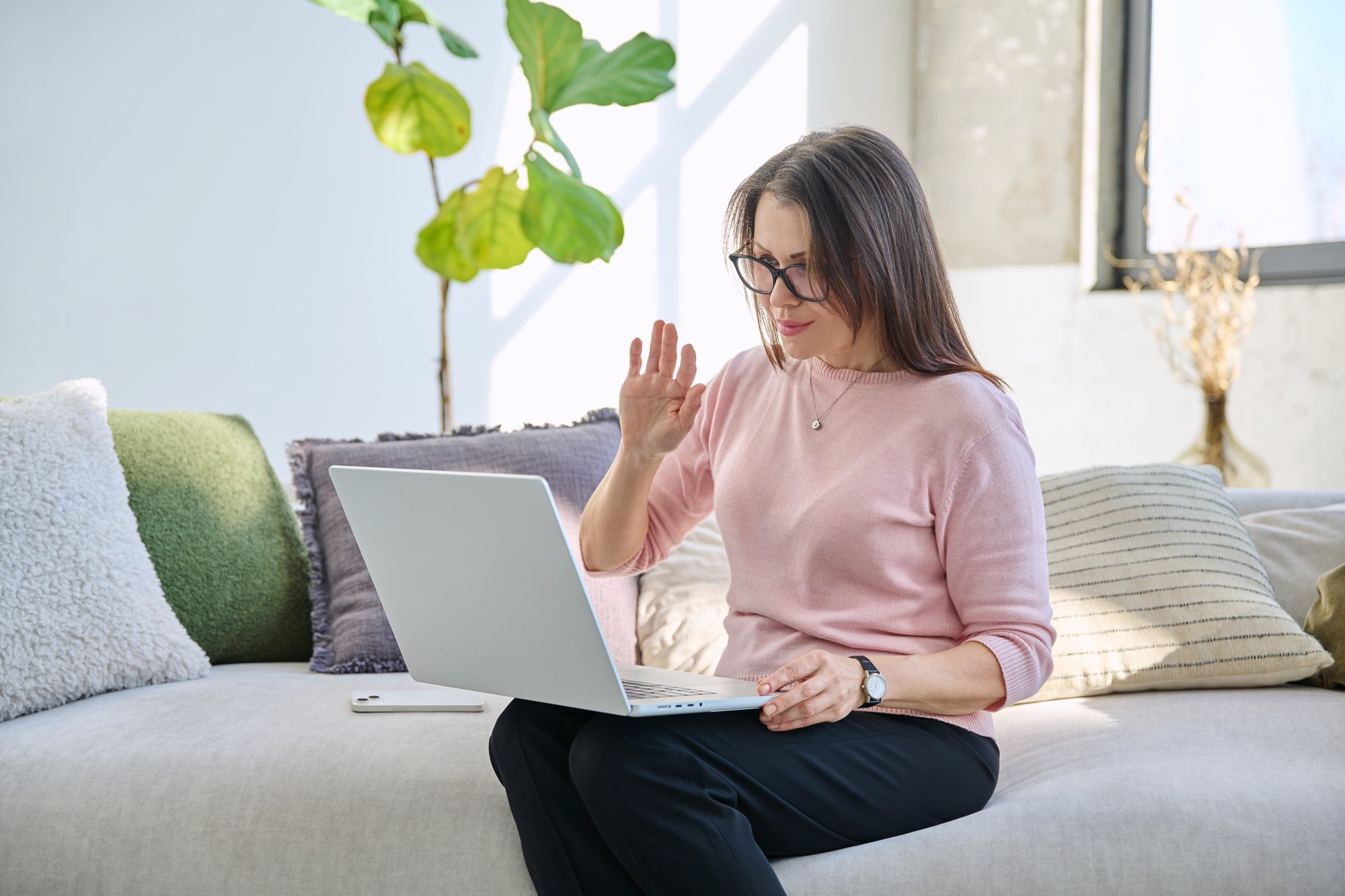 A woman talks to her therapist during virtual mental health treatment in Wisconsin.