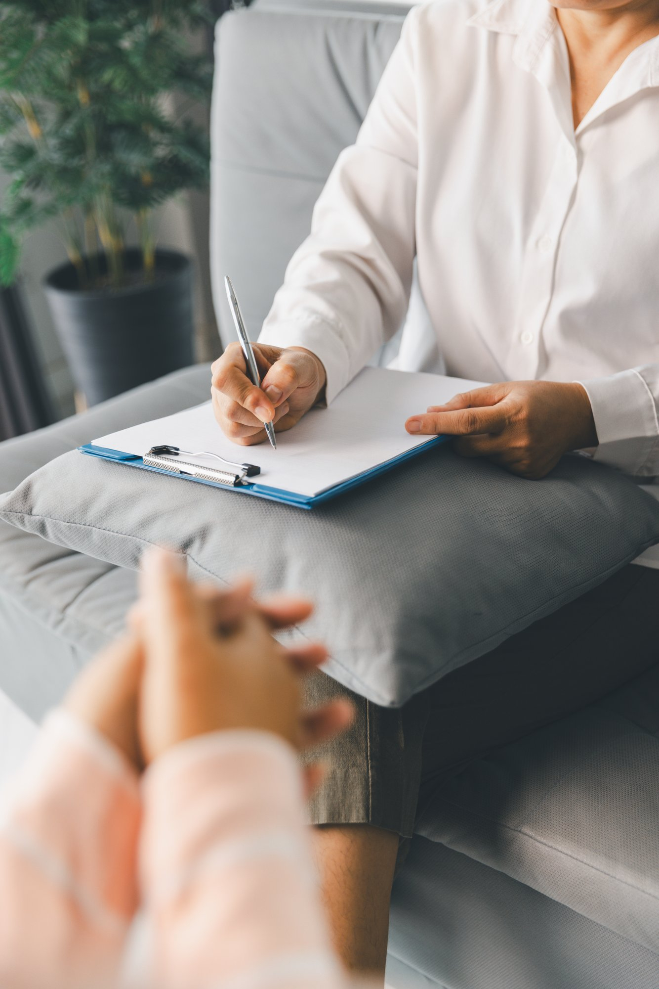 Woman completing paperwork during co-occurring disorder treatment in Mount Pleasant, WI.
