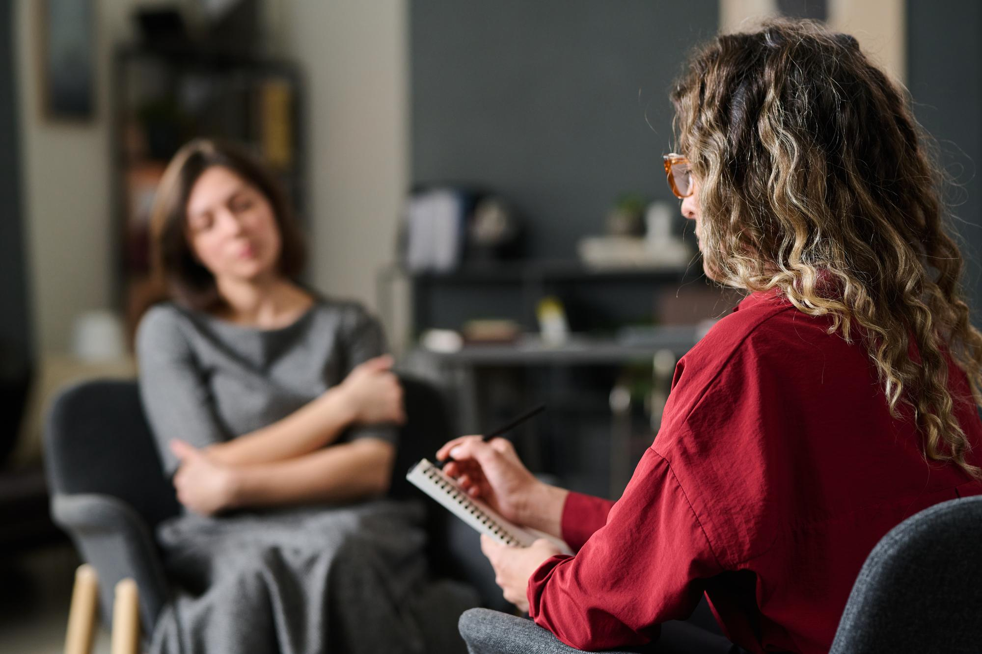 Therapist taking notes while speaking with a patient during fentanyl addiction treatment in Mount Pleasant, WI.