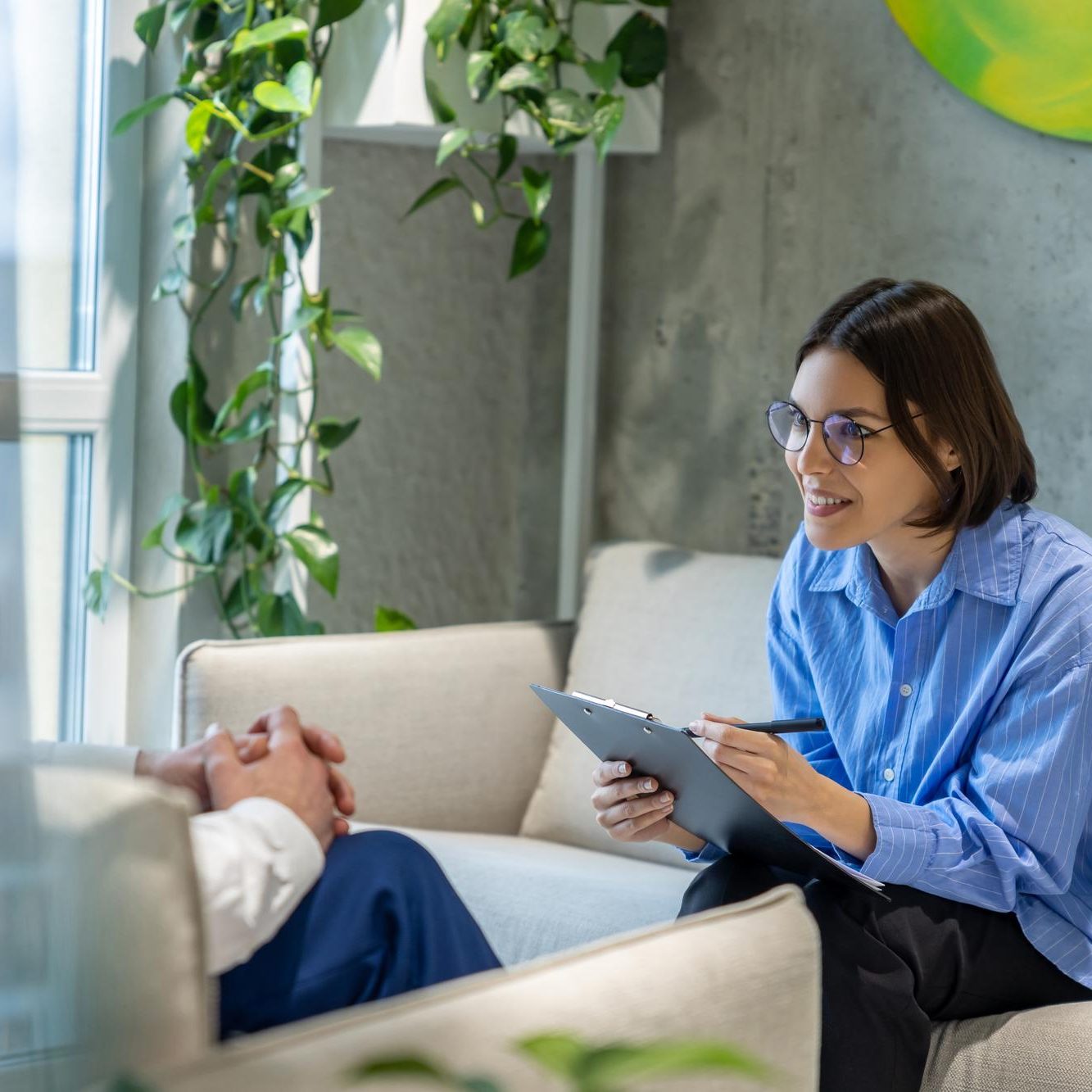 Therapist speaking with a patient during a behavioral health therapy session at Axis Behavioral Health.